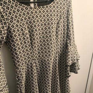 off white and black bell sleeved dress